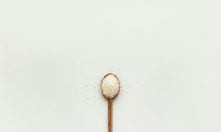 a wooden spoon of salt