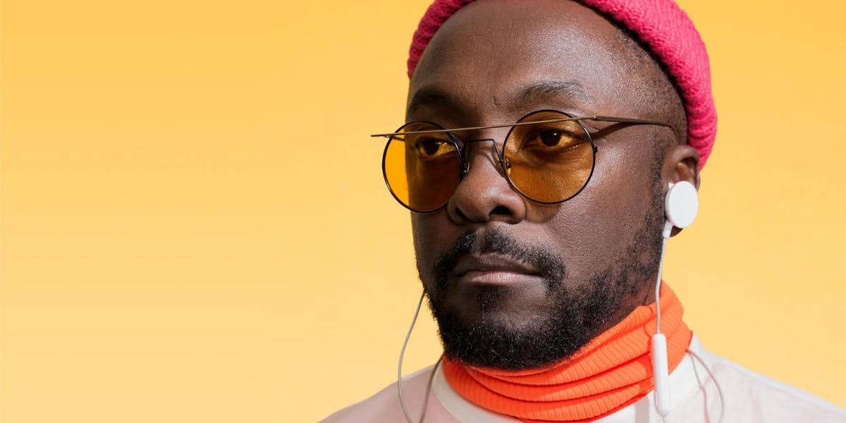 Will.i.am in front of a yellow background