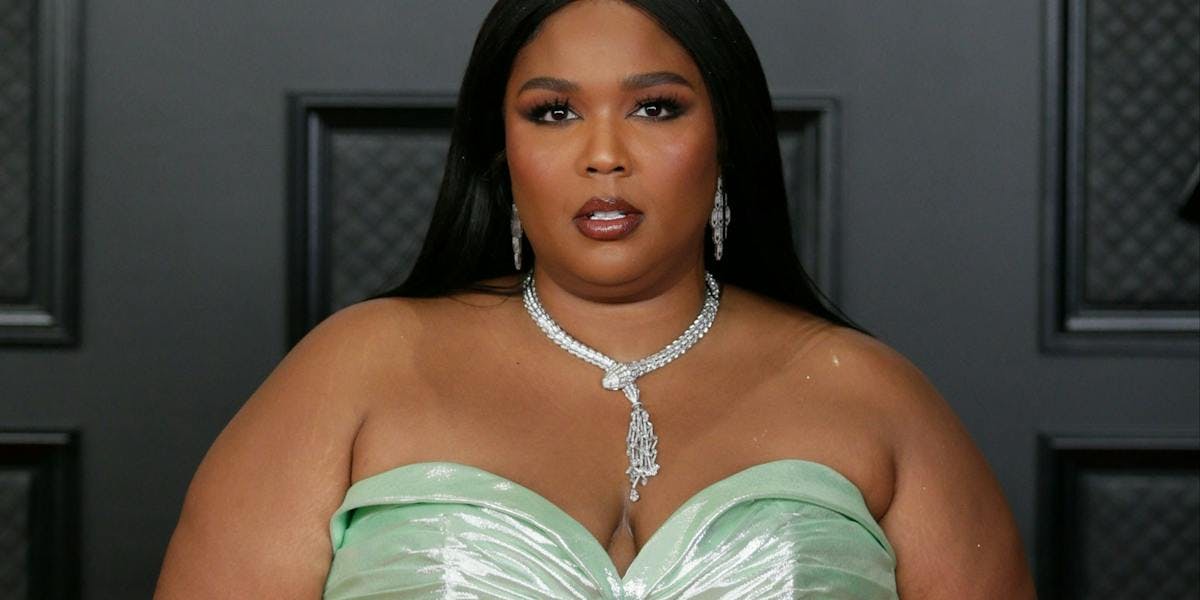 Lizzo in a green dress