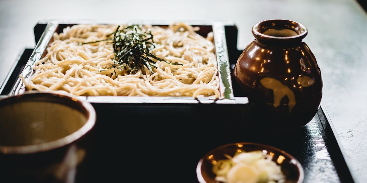 a dish of cold soba noodles and dipping sauce