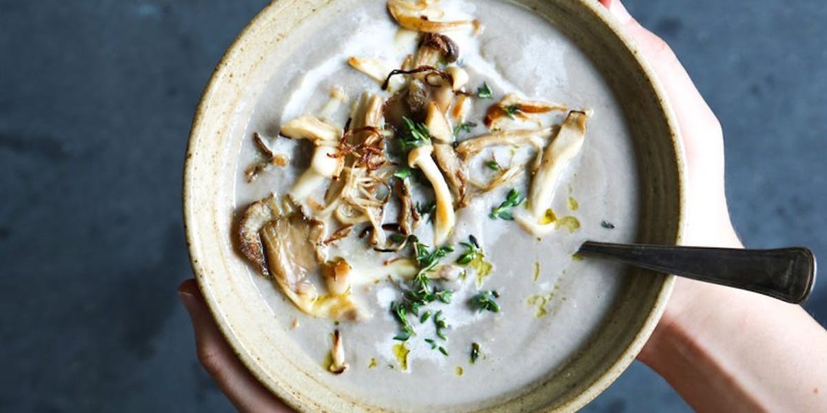 mushroom soup hands on bowl