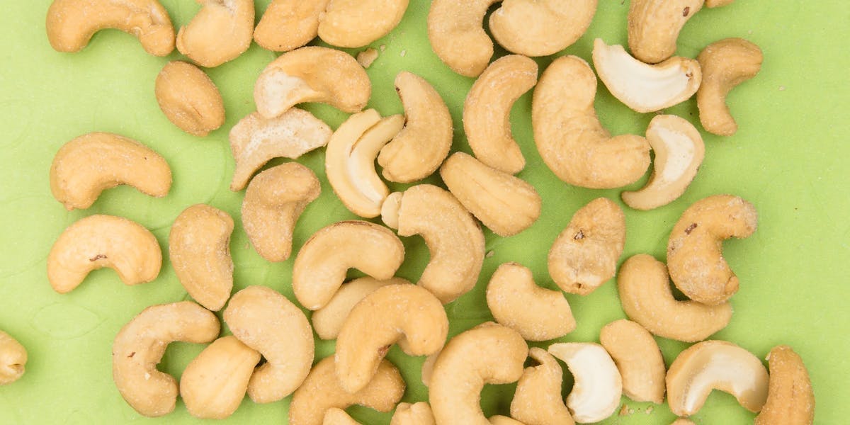cashews on a green background
