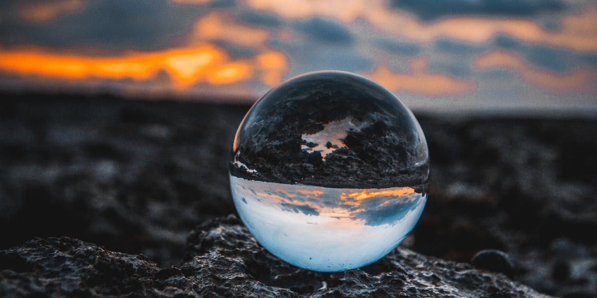 a glass sphere on the beach
