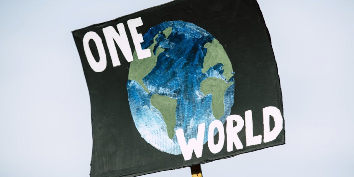sign with 'one world' on