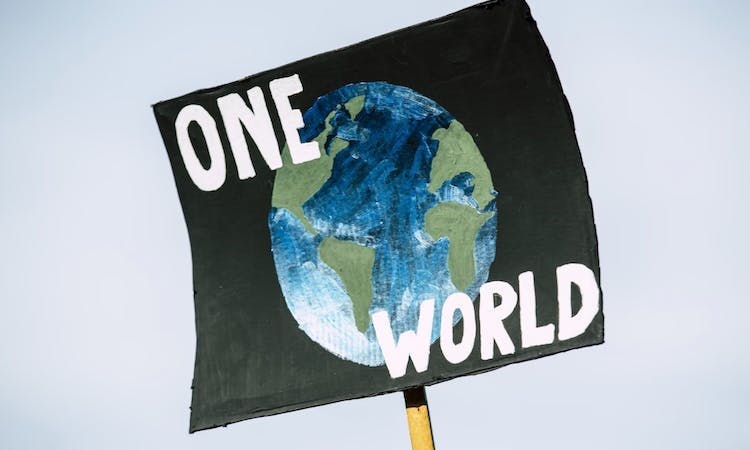 sign with 'one world' on