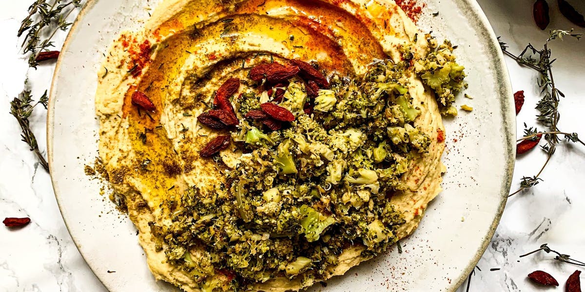 a topped bowl of hummus