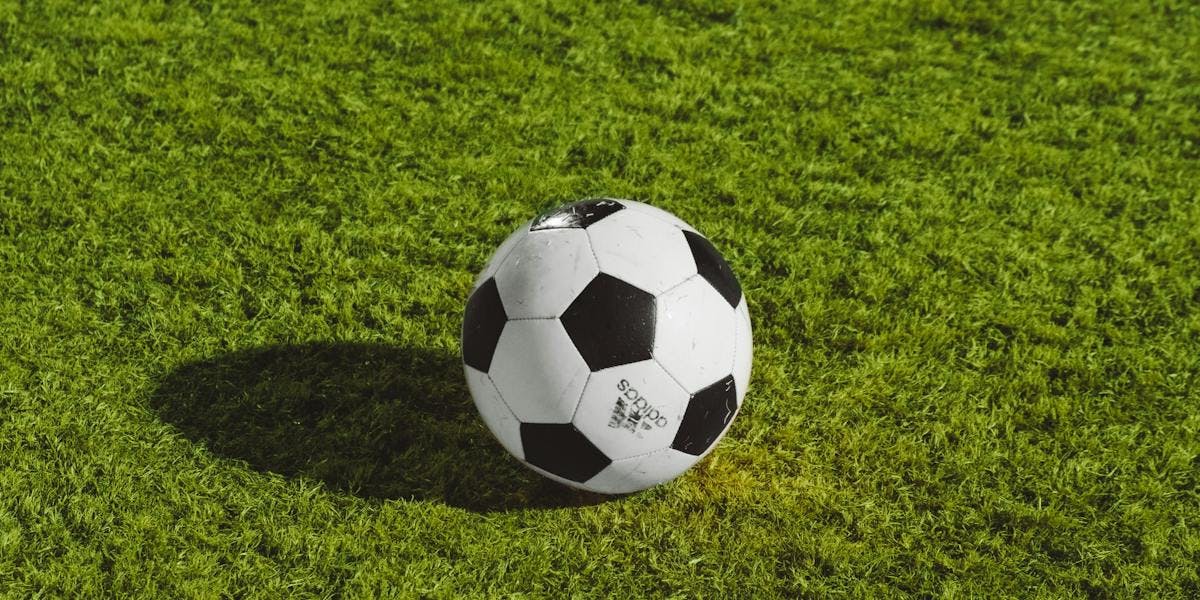 A football on a grass patch