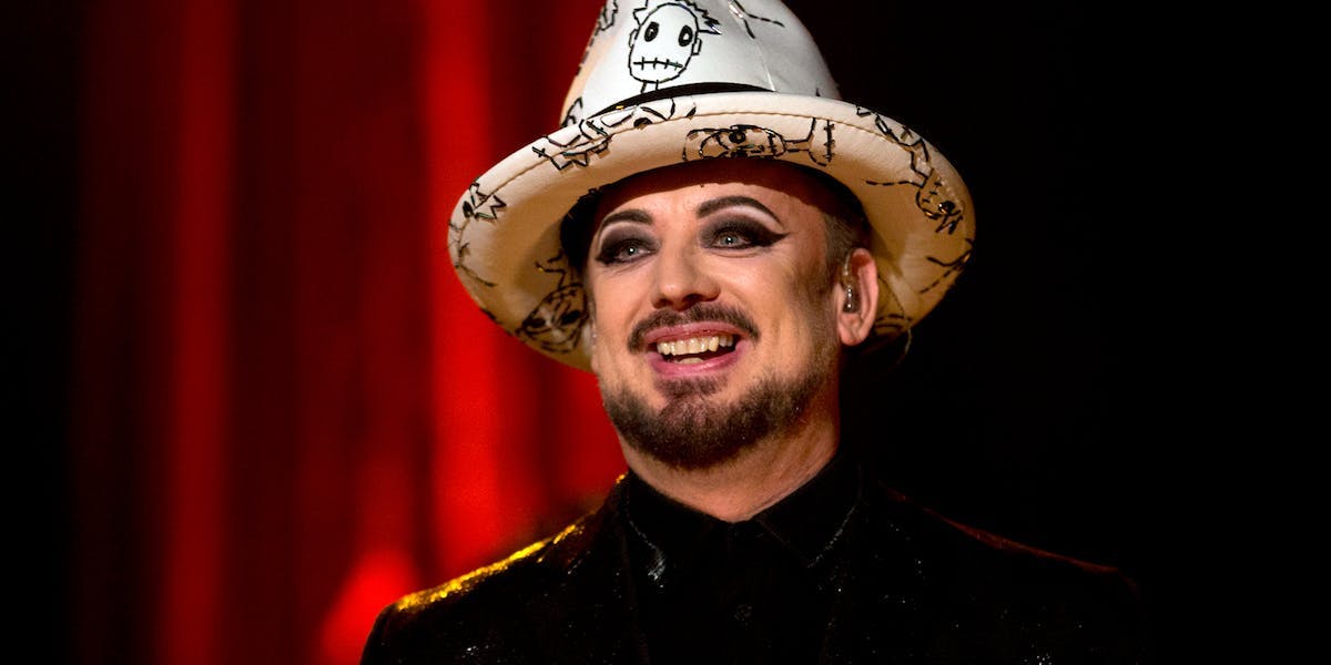 boy george in a white and black hat