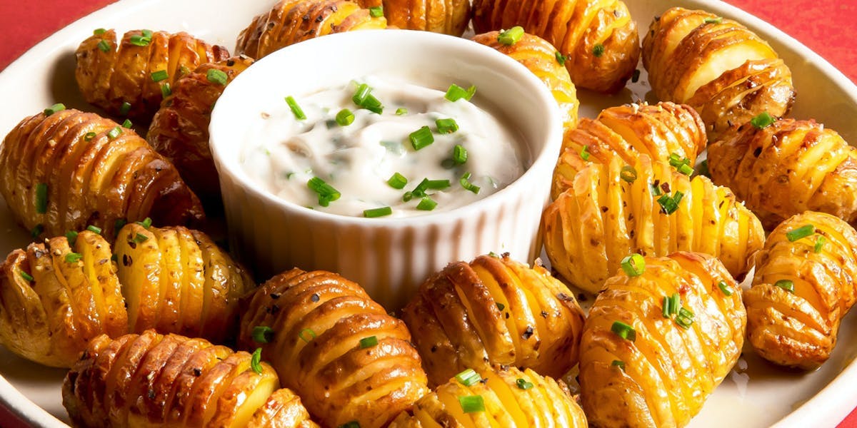 mini-hasselback-potatoes-served-with-creamy-chive-dip