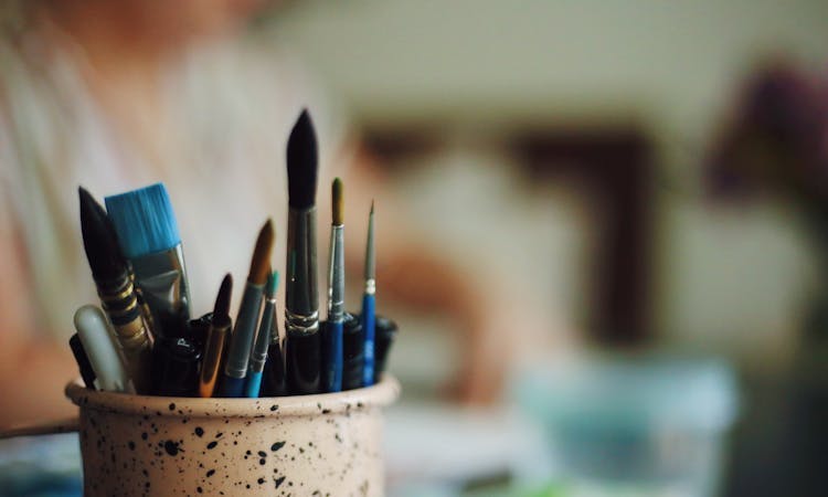 paint brushes in a pot
