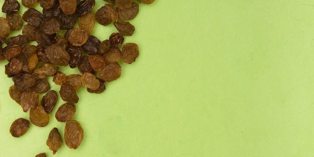 raisins on a bright green background
